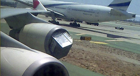 A metal baggage container was sucked into an engine of a Boeing 747 as it was leaving a terminal gate at Los Angeles Airport. 